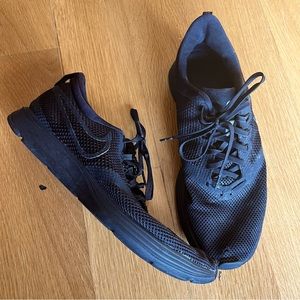 All black Nike running sneakers